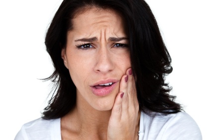 Emergency dental care patient experiencing tooth pain in Scarsdale