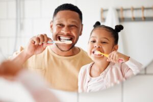 father and daughter practicing proactive dental care in white plains