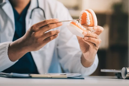 doctor modeling dentures in White Plains