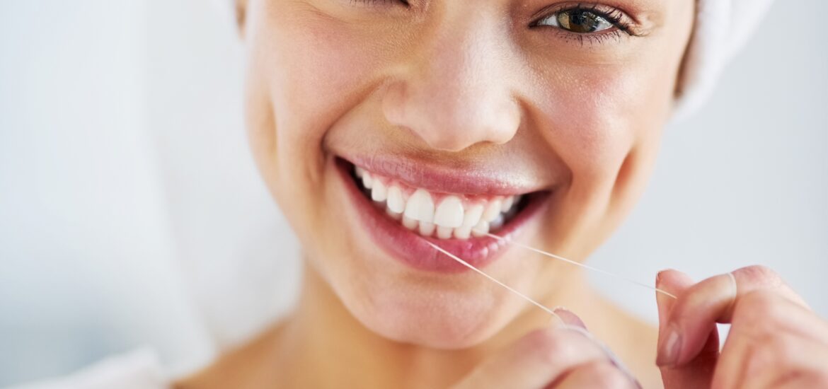 young woman showing off her perfect smile, benefits of cosmetic dentistry